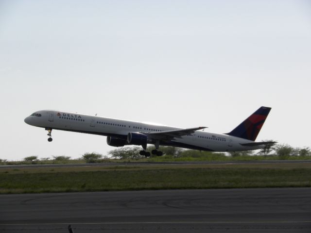 — — - Delta Airlines taking off on Runway