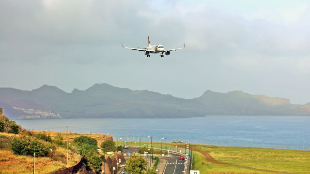 Airbus A320neo (CS-TVG) - Landing runway 23.br /Seen from Airport Viewpoint.br /Caniçal in the distance(on the left).