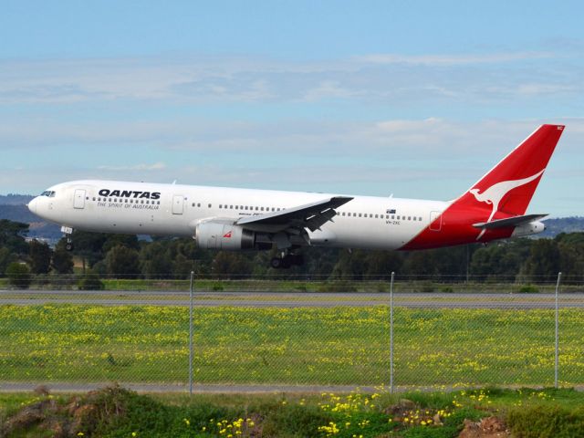 BOEING 767-300 (VH-ZXC) - About to put down on runway 05. Thursday 12th July 2012.