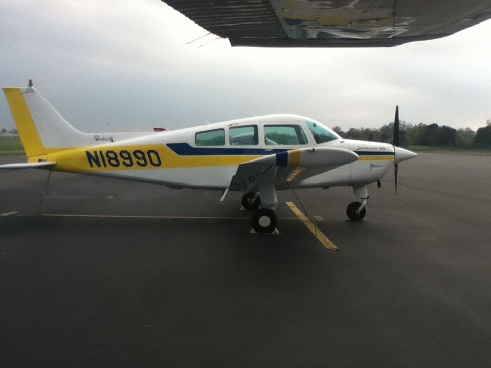 Beechcraft Sundowner (N18990) - looking out the window of N80810 at a Beech C23.