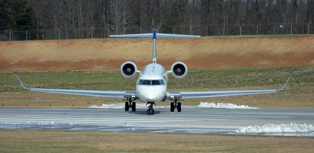 Canadair Regional Jet CRJ-900 (N313PQ) - Overlook. Ready for Takeoff on runway 18C.