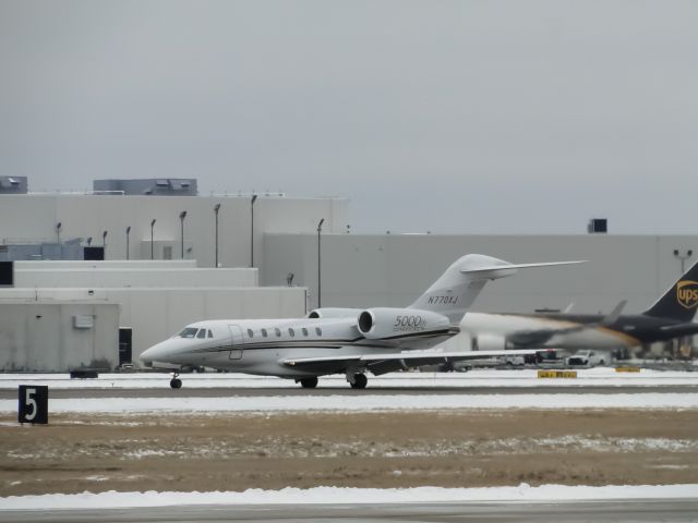 Cessna Citation X (N770XJ) - 5000th Citation made slowing down on 35L following a ice storm in the Louisville area.