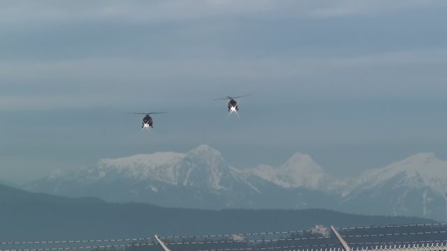 BMJ146 — - 2 CH-146 Griffins coming on to land