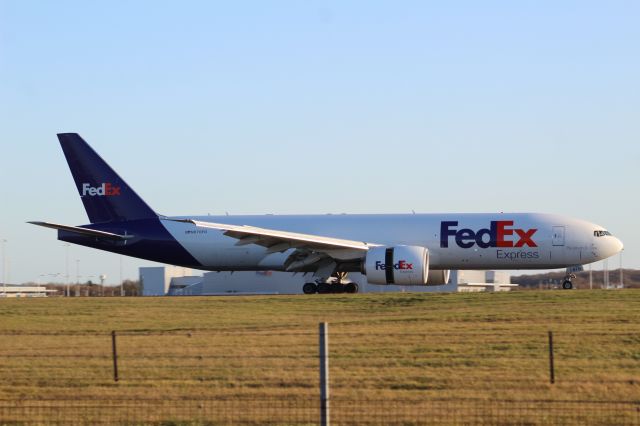 BOEING 777-200LR (N870FD) - A FedEx B777F slowing down after landing on runway 22 at STN.br /br /Location: Stansted Airport.br /Date: 26.12.22 (dd/mm/yy).