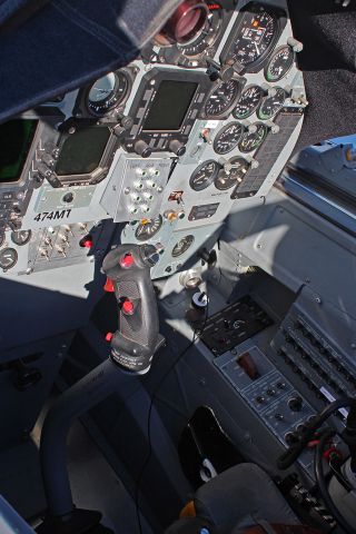 Embraer A-27 Tucano (N474VK) - This photo is a "companion" shot to the picture I posted a few days ago of the Valkyrie Aero Tucano (N474VK - see * NOTE below).br /I'm posting this to show the rear seat cockpit area -- and I specifically focused on the weapons selector buttons and the weapons firing buttons on the stick. It was a little difficult to get this snap because there was both bright sunlight and deep shadows in the cockpit. Also, it was hard to get sharp focus on everything because the cockpit was so small and I was trying to adjust for the two extremes of lighting, so I gave most of my effort to the weapons selector and stick.br /br /* NOTE: The aircraft reg shown on the control panel is now incorrect. Prior to being reregistered as N474VK, this Tucano was indeed registered N474MT. This is the sibling to the aircraft I captured in a previous photo (posted in this gallery) when it was at RNO about 3 years ago with the N484MT registration.