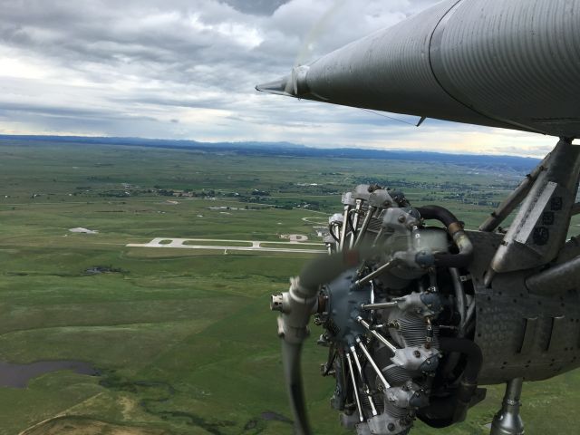 — — - Riding the co-pilot seat in the EAA Trimotor. Arm hanging out the window like an old car, love it!