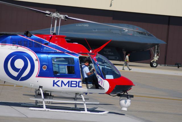 Bell JetRanger (N29S) - News Chopper 9 preparing to take off after Wings Over Whiteman 2009, with the B-2 in the background.