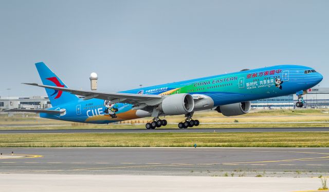 BOEING 777-300ER (B-2002) - China Eastern triple rotates off runway 23 wearing the China International Import Expo livery