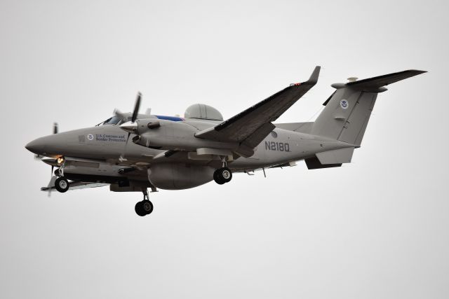 Beechcraft Super King Air 350 (N218Q) - US Dept of Homeland Security - U.S. Customs and Border Control. The appeared out of the overcast and murk. I bet he saw me before I saw him! Landing 23-L at KIND on 12-10-19