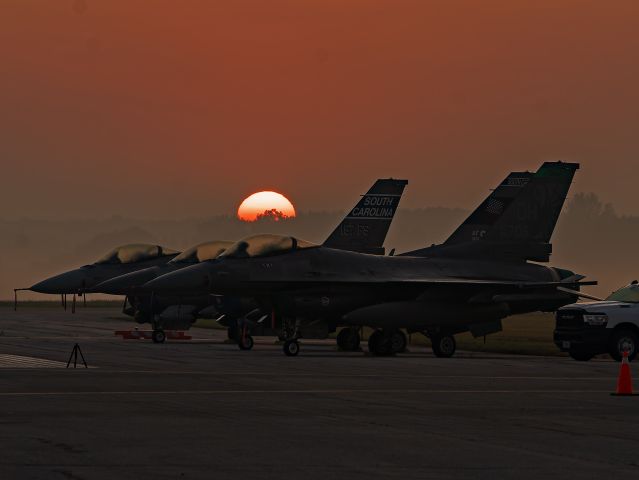 F16 — - A beautiful sunrise over three F-16 Fighting Falcons at Airshow London on Sunday morning, 15 Sep 2024. 90-0706 is from the 180th Fighter Wing, Toledo Ohio, ANG, and 92-3911 and 93-0551 are from the 169th Fighter Wing, Columbia, SC, ANG.