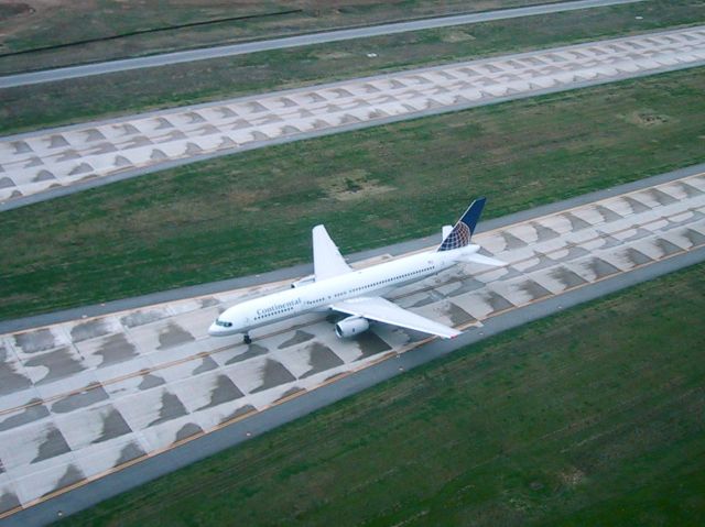 Boeing 757-200 — - Continental 757-200 holding on taxiway Alpha, west of 17L/35R waiting for release from Houston.