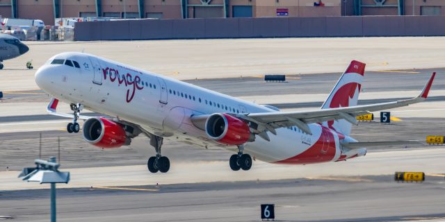 Airbus A321 (C-FJQL) - An Air Canada Rouge A321 taking off from PHX on 2/11/23 during the Super Bowl rush. Taken with a Canon R7 and Canon EF 100-400 II L lens.