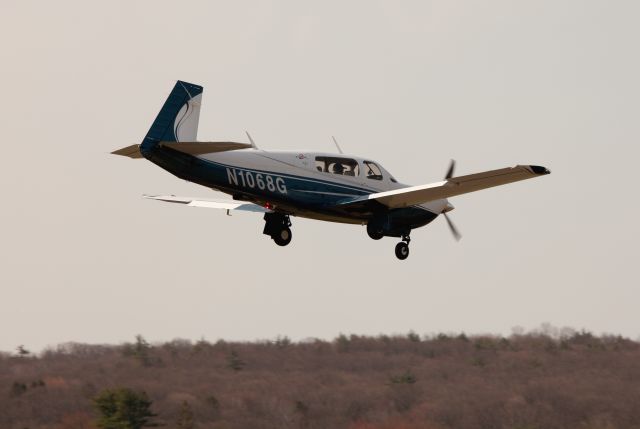 Mooney M-20 (N1068G) - Landing RW 26. RELIANT AIR has the lowest fuel price on the Danbury (KDXR) airport.