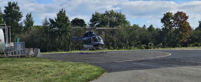 Bell 407 (N707NA) - Power line inspection crew taking a lunch break and topping off with Jet-A+!