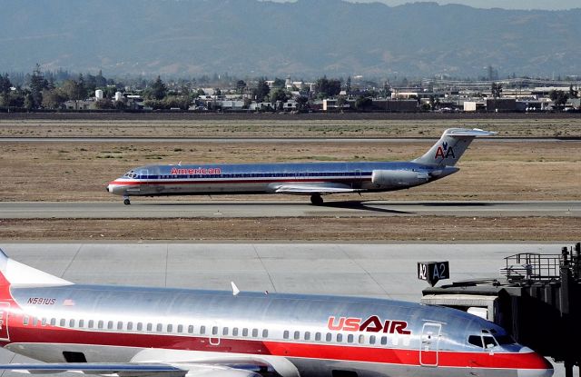 McDonnell Douglas MD-80 (N207AA) - KSJC - in the early 90s, AA scaled down their operations at SJC A Terminal and US Air quickly moved in after ruining PSA. Photo from atop the parking structure as American Airlines N207AA taxis to the terminal after landing 30L.