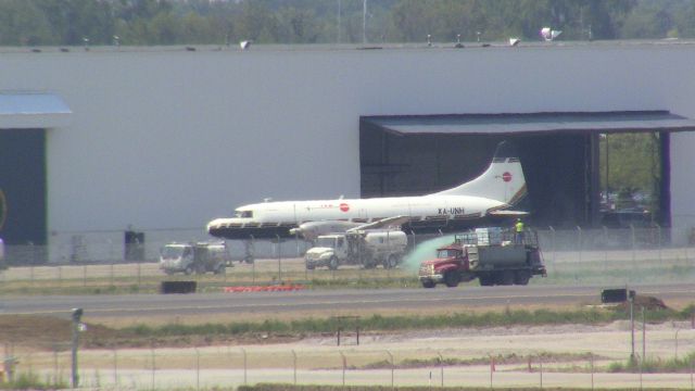 CONVAIR CV-580 (XA-UNH) - This Convair is a long way from her home.