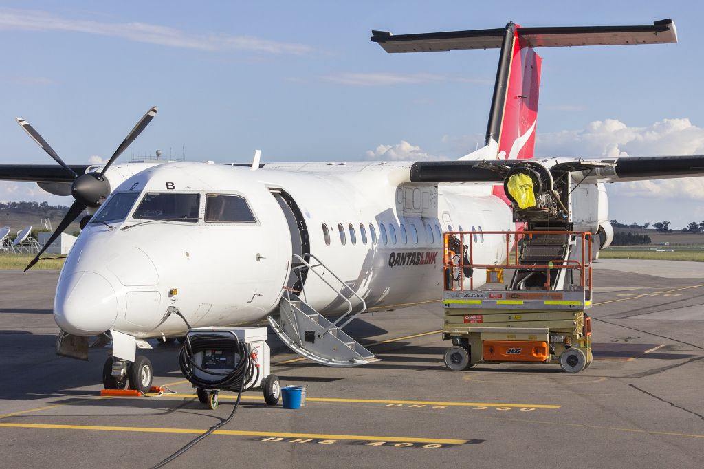 de Havilland Dash 8-300 (VH-SBB) - Eastern Australia Airlines [QantasLink] (VH-SBB) de Havilland Canada DHC-8-315Q receiving some maintenance on the tarmac at Wagga Wagga Airport.