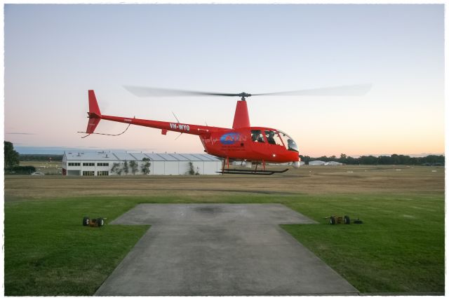 Robinson R-44 (VH-WYO) - Bankstown, Heliflite hangar/pad.