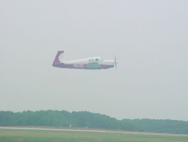 Mooney M-20 (N518T) - Departing rwy 09 on 6/11/10