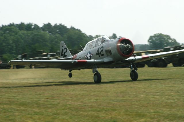— — - T-6 Texan Departing Grass Strip at Warbirds North Trego, WI USA