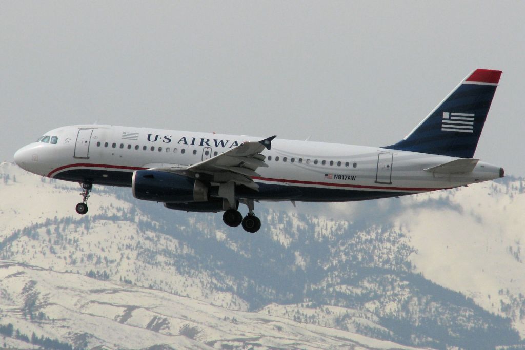 Airbus A319 (N817AW) - The FA photo gallerys first photo of N817AW shows it within seconds of touching down on Reno Tahoe Internationals runway 16R.