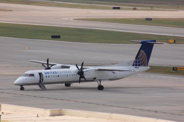 de Havilland Dash 8-400 — - Dash 8-400 parked at IAH.