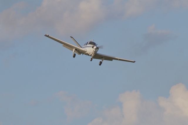 Beechcraft 35 Bonanza (N211EE) - Landing 18 at KOSH