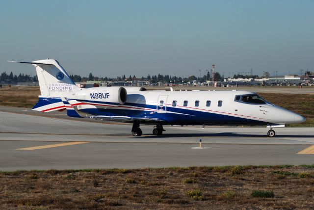 Learjet 60 (N98UF) - N98UF owned by the Universal Funding Corp. holding short of 30L.