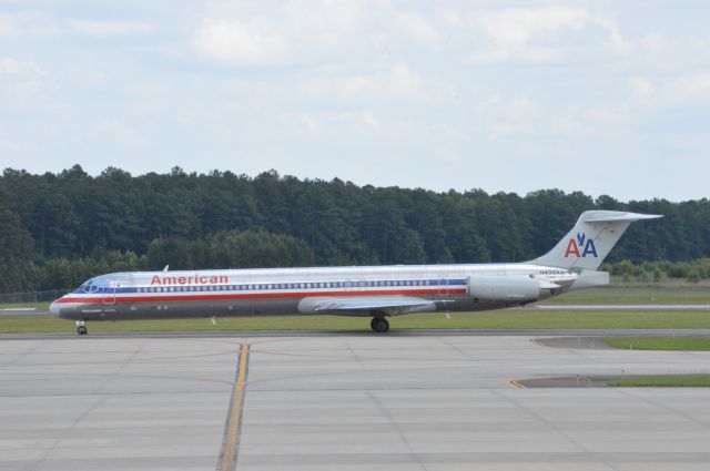 McDonnell Douglas MD-82 (N438AA) - N438AA is taxing out to Runway 23L for departure out to Chicago O'Hare.  While the grass was being cut along Runway 23R/5L Runway 23L/5R was the exclusive runway for aircraft traffic.  This process at RDU takes about 4-5 hours.  Photo taken June 19, 2016.