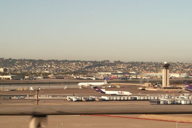 BOEING 767-400 (N76054) - The United Boeing 767-400 is most likely the Buffalo Bills charter plane. Also note the FedEx B722. Photo taken from the highway heading north.