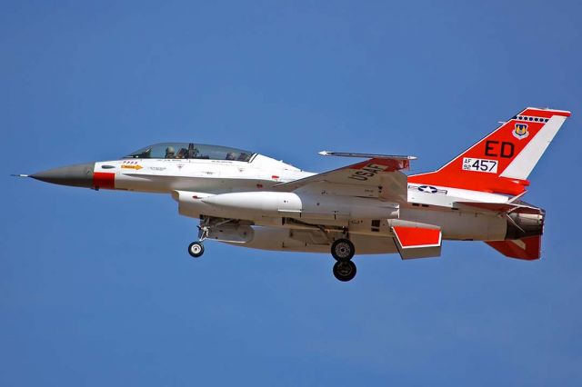 Lockheed F-16 Fighting Falcon (92-0457) - General Dynamics F-16B Block 15AS OCU Fighting Falcon 92-0457 of the 412th Test Wing made a touch and go landing on Runway 25 at Air Force Plant 42 in Palmdale, California just before 10:00 in the morning on February 2, 2006. It was ordered by Pakistan in the early 1990s. Due to technology transfer restrictions, the order of F-16s was embargoed. This F-16B was stored at AMARC for several years before being assigned to the 412th Test Wing at Edwards Air Force Base. The embargo was lifted in 2006 and this F-16 was delivered to the Pakistan Air Force on July 28, 2008 as 94623. 