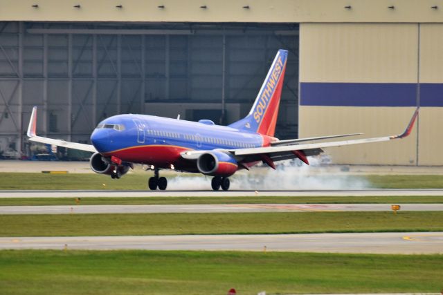 Boeing 737-700 (N240WN) - Touching down on runway 14 on 08-31-21