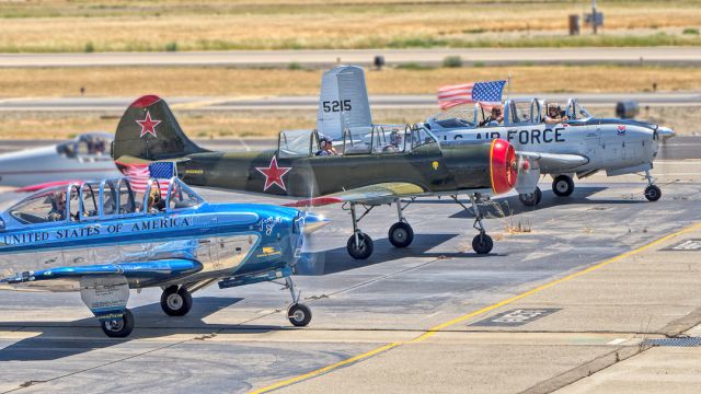 YAKOVLEV Yak-52 (N82623) - Fr to Bk:N134JC Beech T34 Mentor, N82623 Yakovlev Yak-52, N88PF Beech Mentor at Livermore Municipal Airport after 16 plane formation flight on Memorial Day 2022.