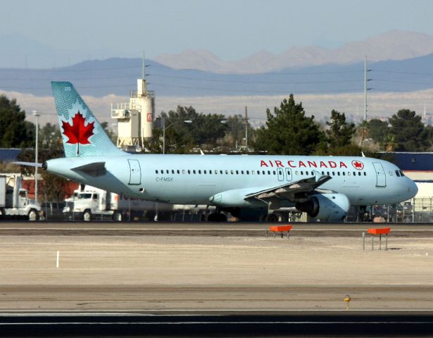 Airbus A320 (C-FMSX) - KLAS - Toronto bound A320 rolling to the hold bars at 25R.