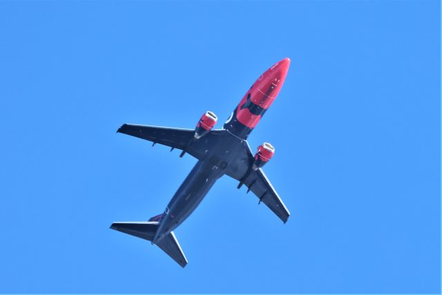 C-GGWX — - C-GGWX Boeing 737 408 Nolinor Aviation de Quebec YQB vers Montreal YMX survolant le fleuve St-Laurent QC à Lavaltrie le 15-03-2023à 