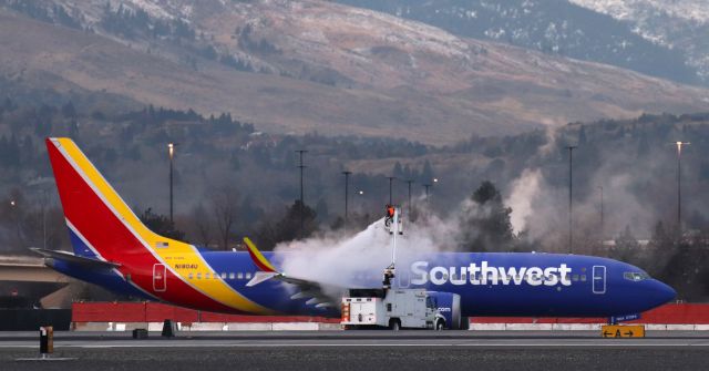 Boeing 737 MAX 8 (N1804U) - During its RON stay at RNO, N1804U got a bit "frosty" in the 18 degree F overnight temp so "Iceman 2" is captured here deicing it prior to its 7:30 AM departure to KLAS.