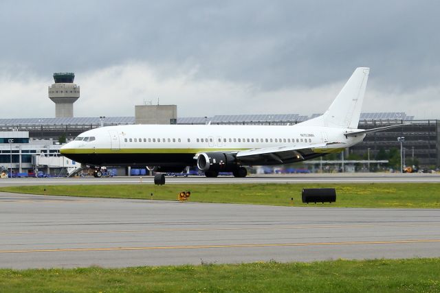 BOEING 737-400 (N753MA) - BSK 8804 arriving with NASCAR personnel for the 5-Hour Energy 301: NASCAR Sprint Cup Series Race at New Hampshire Motor Speedway.
