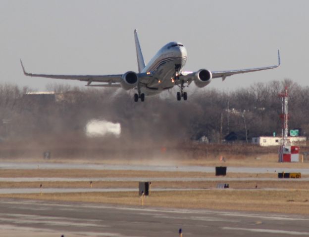 Boeing 737-700 — - Watching form service road at the approach end of Runway 12 at Gary Regional Airport.