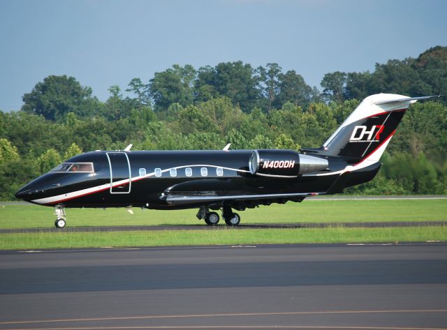 Canadair Challenger (N400DH) - JOE GIBBS RACING INC (NASCAR driver Denny Hamlin) returning from the Brickyard 400 at KJQF - 7/28/13