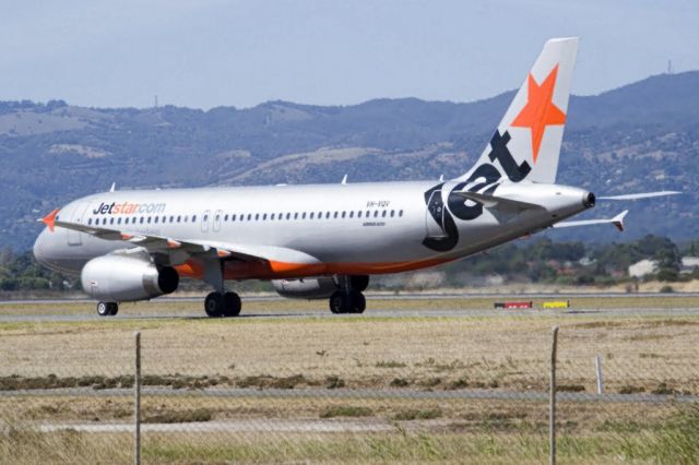 Airbus A320 (VH-VQV) - On taxi-way heading for Terminal 1 after using the entire length of runway 23 to pull up. Thursday, 4th April 2013.