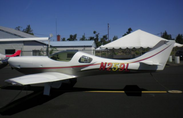 Lancair Legacy 2000 (N259L) - N259L is a unique 2005 Lancair Legacy with TurboNormalized IO-360 engine, two-blade propeller and retractable gear. The Turbos intake is visible on the left side of lower cowling.  Shown here on display at the 30th Annual Lancair Fly-In in Redmond, Oregon.