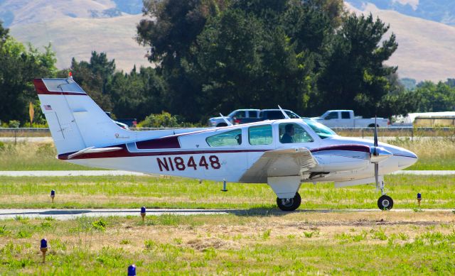 Beechcraft 55 Baron (N18448) - Beechcraft Baron 55 taxing to the transient parking before a formation flight at San Martin Airport.