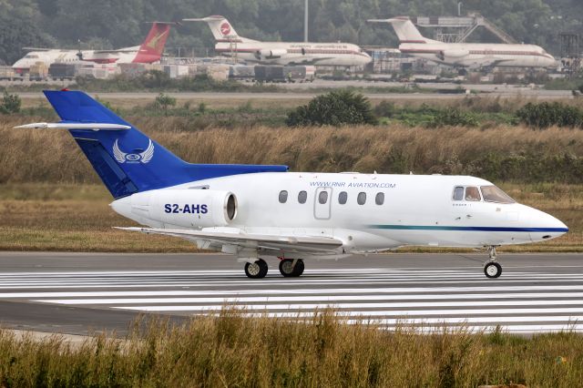 S2-AHS — - 25th Dec., 2015;  Built by British Aerospace back in 1982, this BAe 125-800A is currently operated by R&R Aviation. Prior to her Bangladesh registration, she was registered under a US Corporation based out of Huston, Texas who de-registered her in 2011. Seen here on 25th Dec., 2015, the aircraft is taxiing on to the active for departure. Background shows some of the inmates of Dhakas aircraft graveyard.