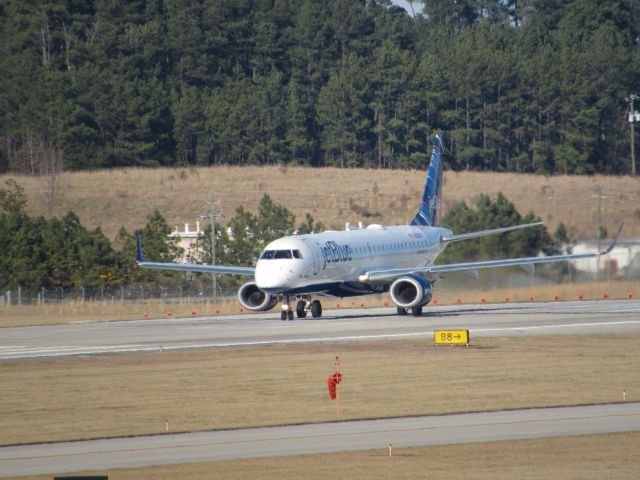 Embraer ERJ-190 (N328JB) - JetBlue flight 1084 to Logan Intl, an Embraer 190 lined up for takeoff on runway 23R. This was taken January 30, 2016 at 3:30 PM.