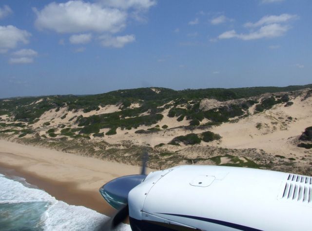 Cessna 402 (ZS-MSH) - Low level flight along the Mozambique coast.