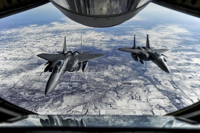 — — - Two F-15E Strike Eagles wait to receive fuel from a KC-135R Stratotanker during exercise Red Flag 15-1 on their way to Nellis Air Force Base, Nev., Jauary. 23, 2015. The F-15s are assigned to the 4th Fighter Wing. U.S. (Photo by Airman 1st Class Aaron J. Jenne/Reuters)