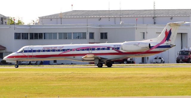 Embraer ERJ-145 (N691AE) - Pink ribbon in support of breast cancer awareness.