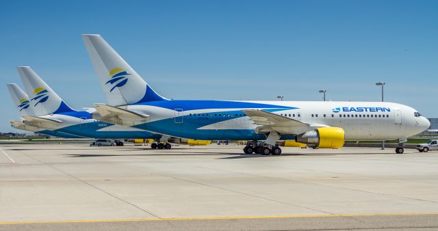 BOEING 767-200 (N602KW) - Three of the six Eastern birds leased by Sunwing Airlines. With two Eastern 767's in storage I think Sunwing is using their entire fleet! When I took this shot there were two more at the infield terminal and one away on a mission to the Caribbean. Behind sits N703KW and N700KW, both B763's