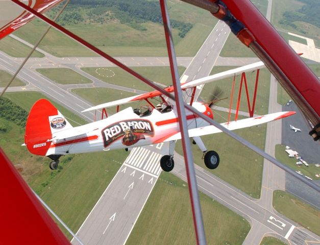 N802RB — - 1943 Boeing E75 -Red Baron Pizza N802RB over Danville Regional Airport in Danville Va..  6/9/04