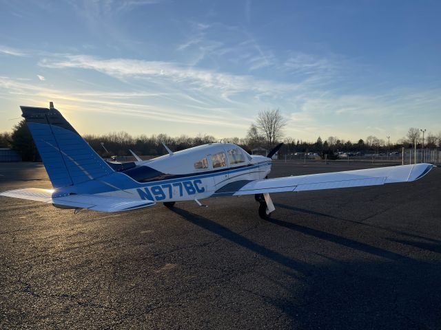 Piper Cherokee Arrow (N977BC) - 1976 PA-28R-200 on the ramp at Old Bridge during sunset.